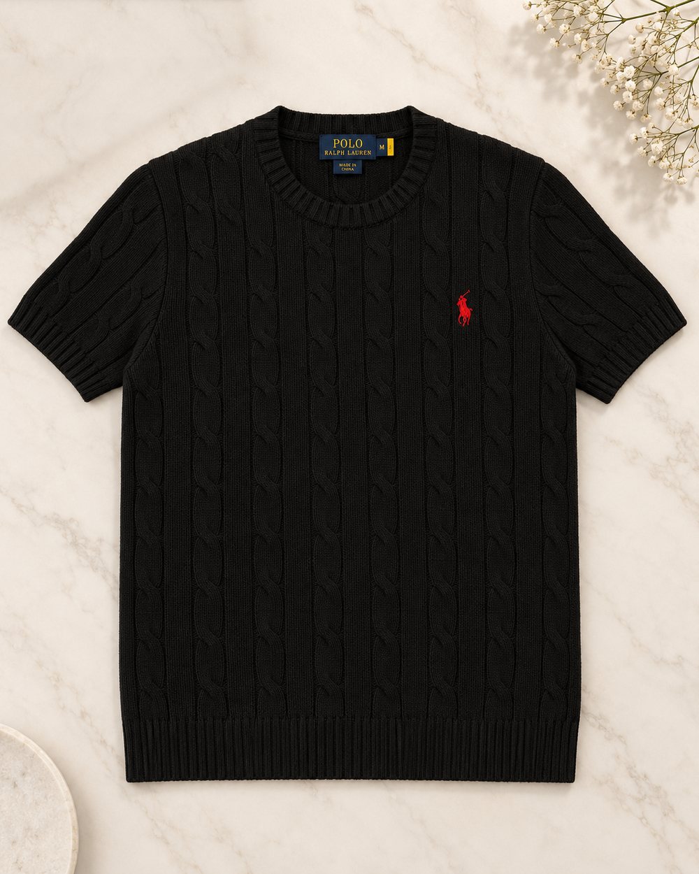 The same knit laid flat in a clean studio-style photo